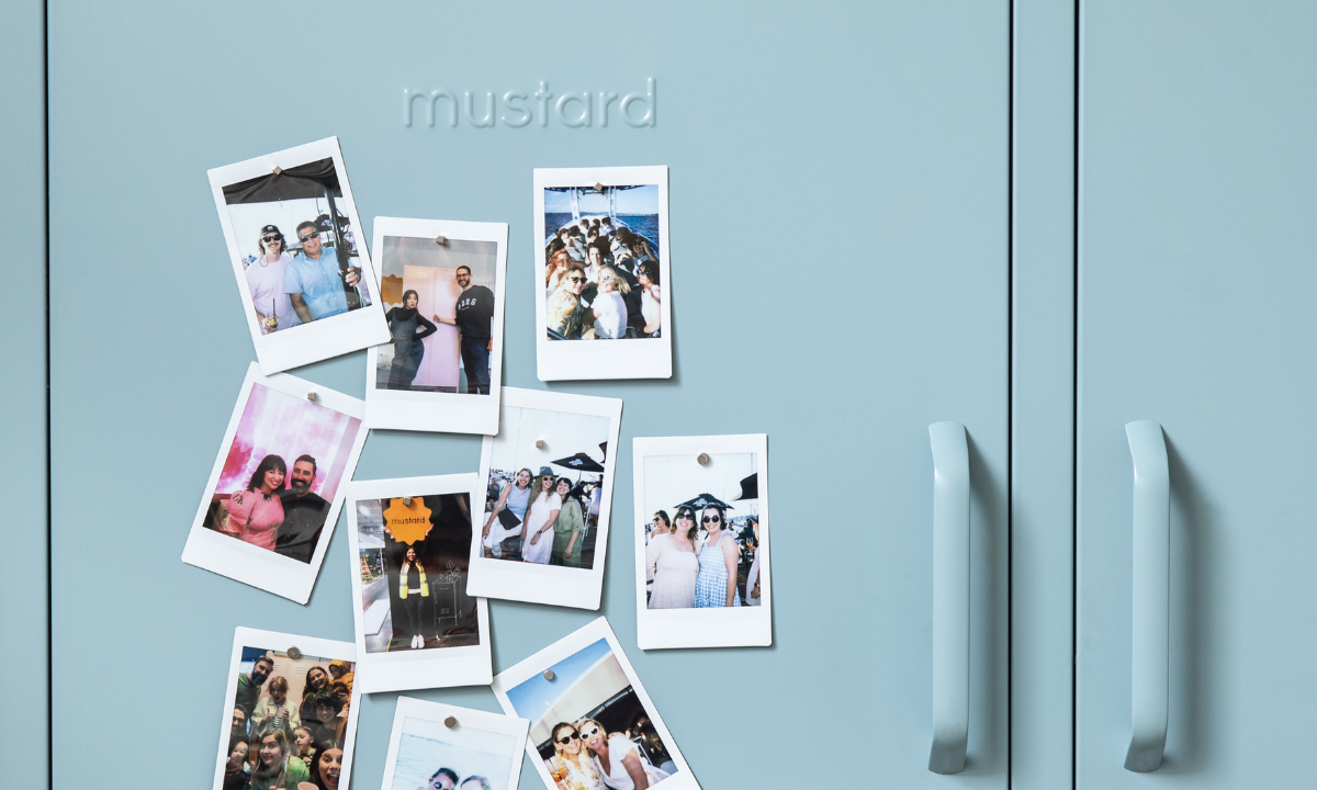 A collection of polaroids are stuck to the front of an Ocean locker door.