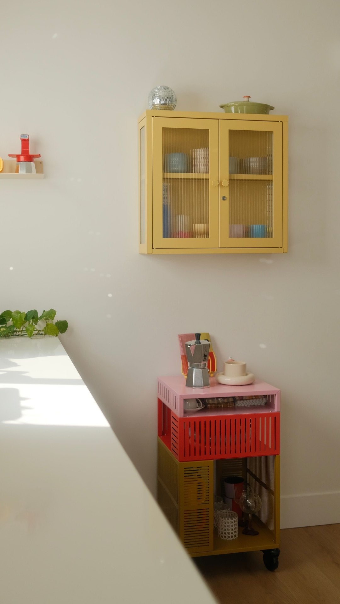 The Kit glass cabinet in Butter yellow, wall-mounted
